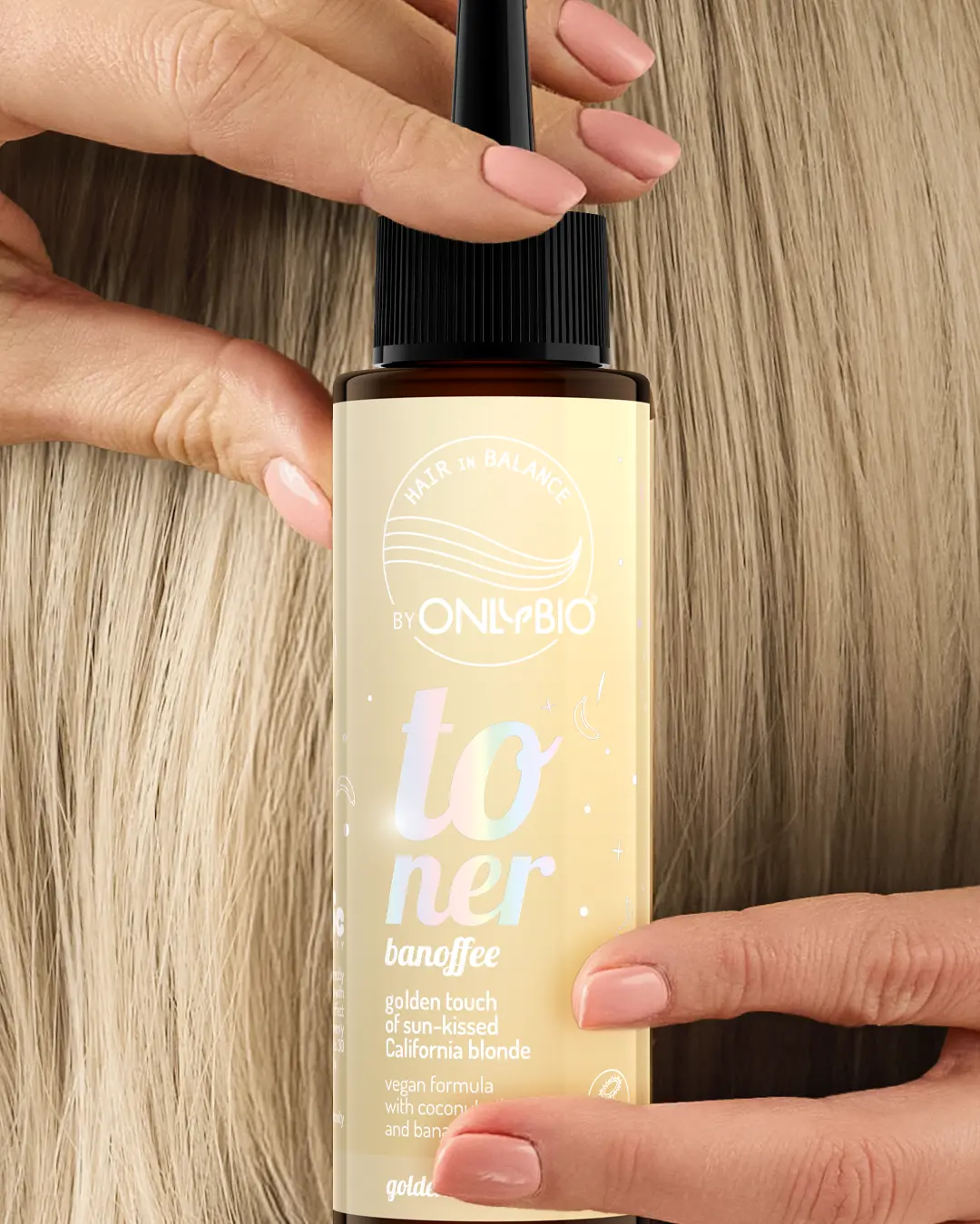 A bottle of OnlyBio hair toner against a background of hair