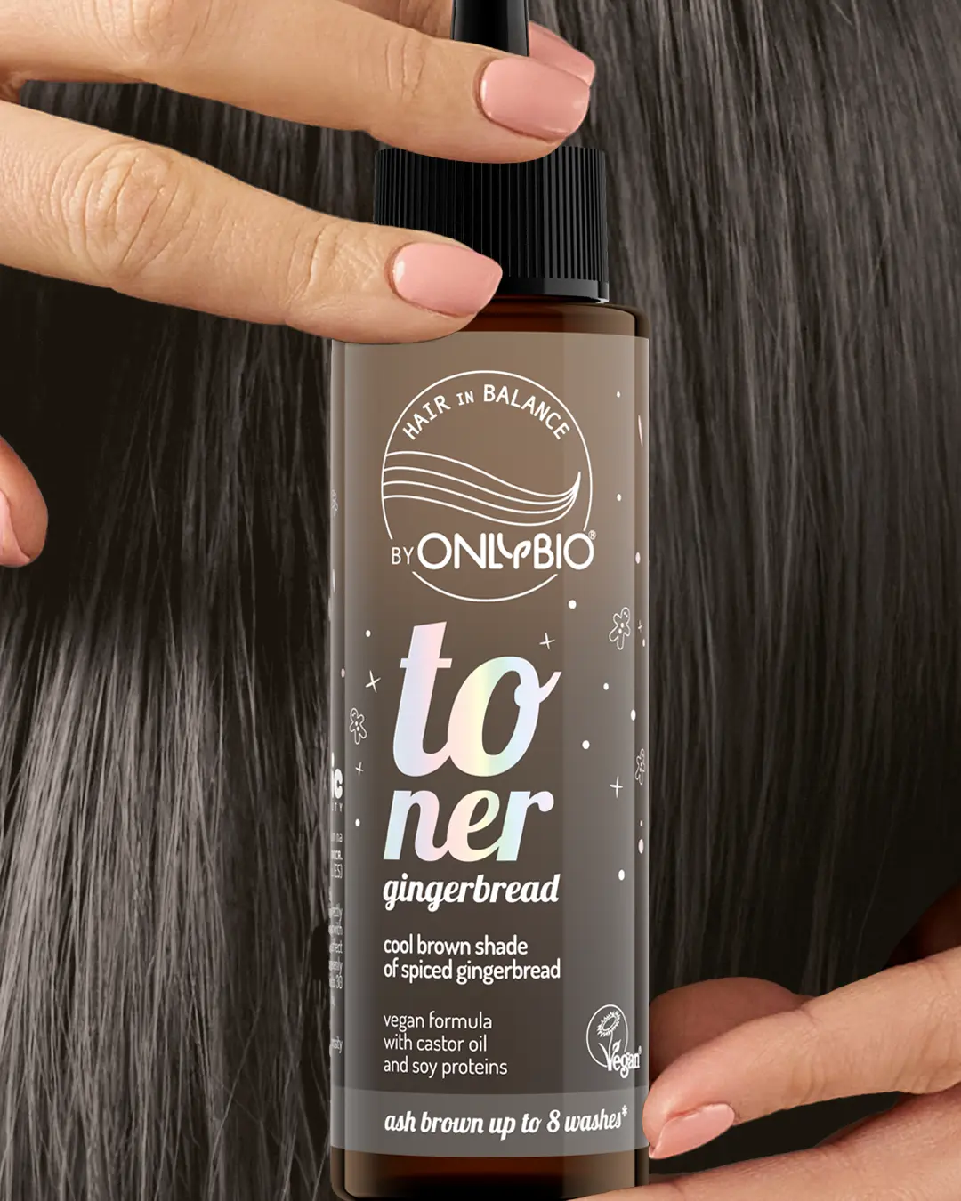 A bottle of OnlyBio hair toner against a background of hair